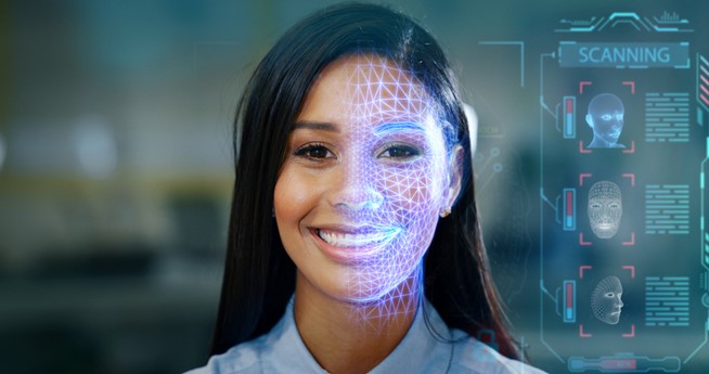 A person smiling with a grid on her face
Description automatically generated