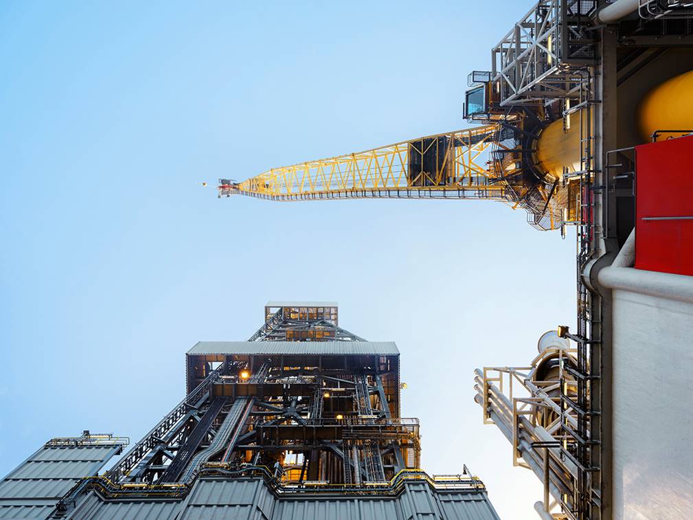 A crane over a city
Description automatically generated