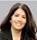 A close-up of a person smiling
Description automatically generated