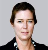 A person with brown hair wearing a black and white shirt
Description automatically generated