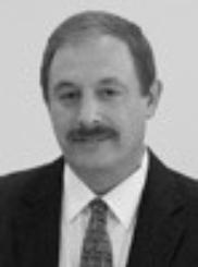 A person wearing a suit and tie
Description automatically generated